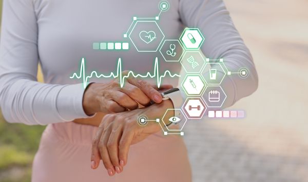 Woman checking her fitness tracker with data on the screen