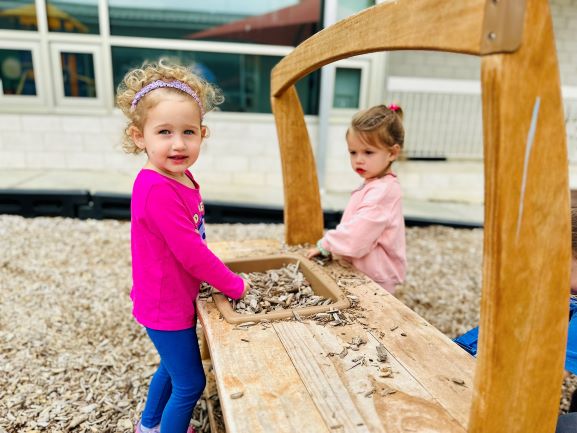 kids playing a hopping game in a field at camp jcc